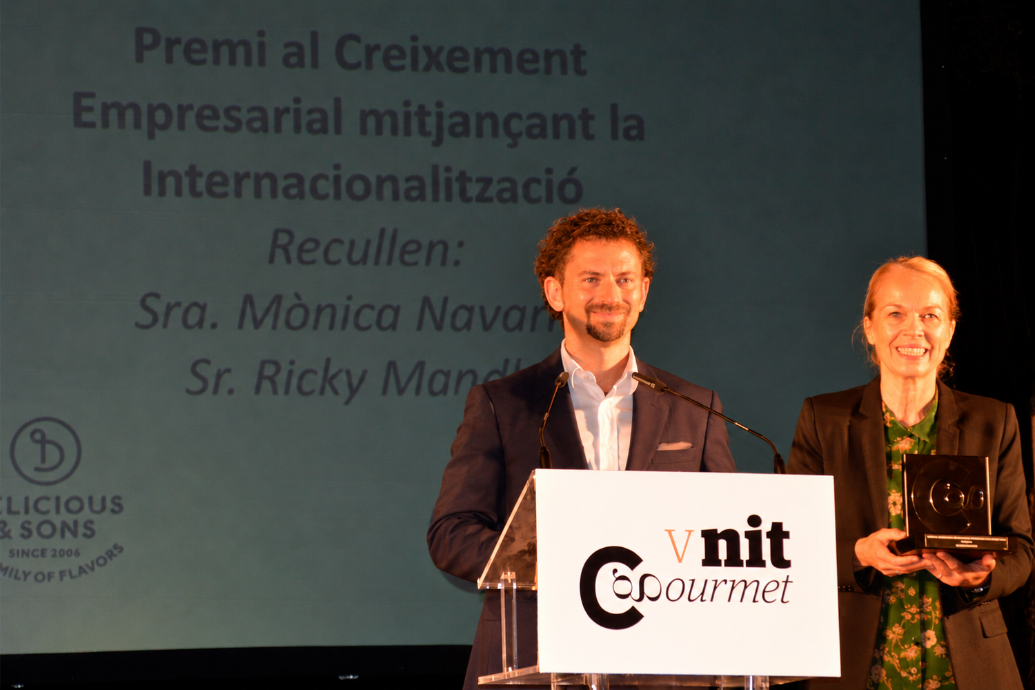 Ricky Mandle and Monica Navarro receiving the award for Delicious & Sons